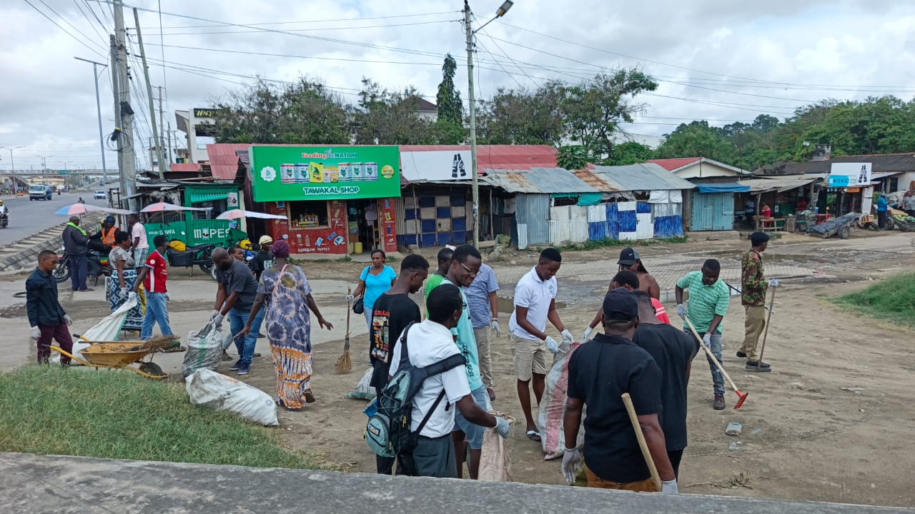 Youth participating in an environmental clean-up